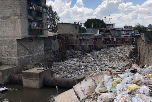 A river in Nairobi, Kenya, clogged with plastic and other garbage.